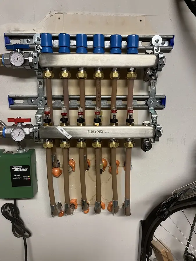 Plumber performing Water Heater Repair at a residential property in Bergen